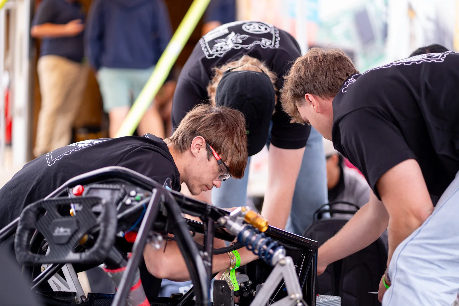 An action shot of engineerings working on the car