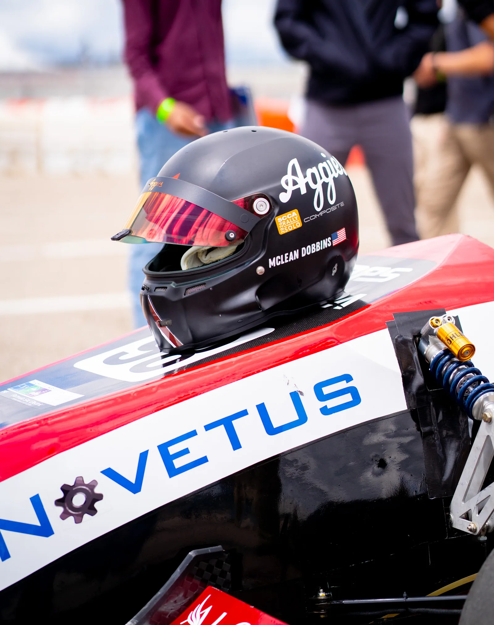 The drivers helmet sitting on the nosecone of AME26
