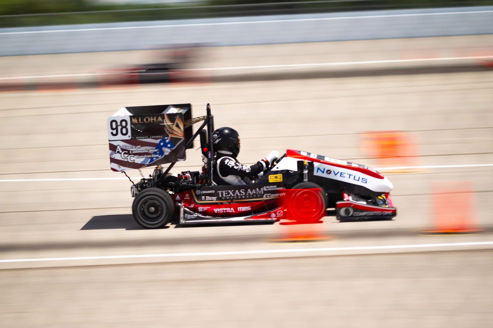 AME26 driving fast with the background blurred in motion