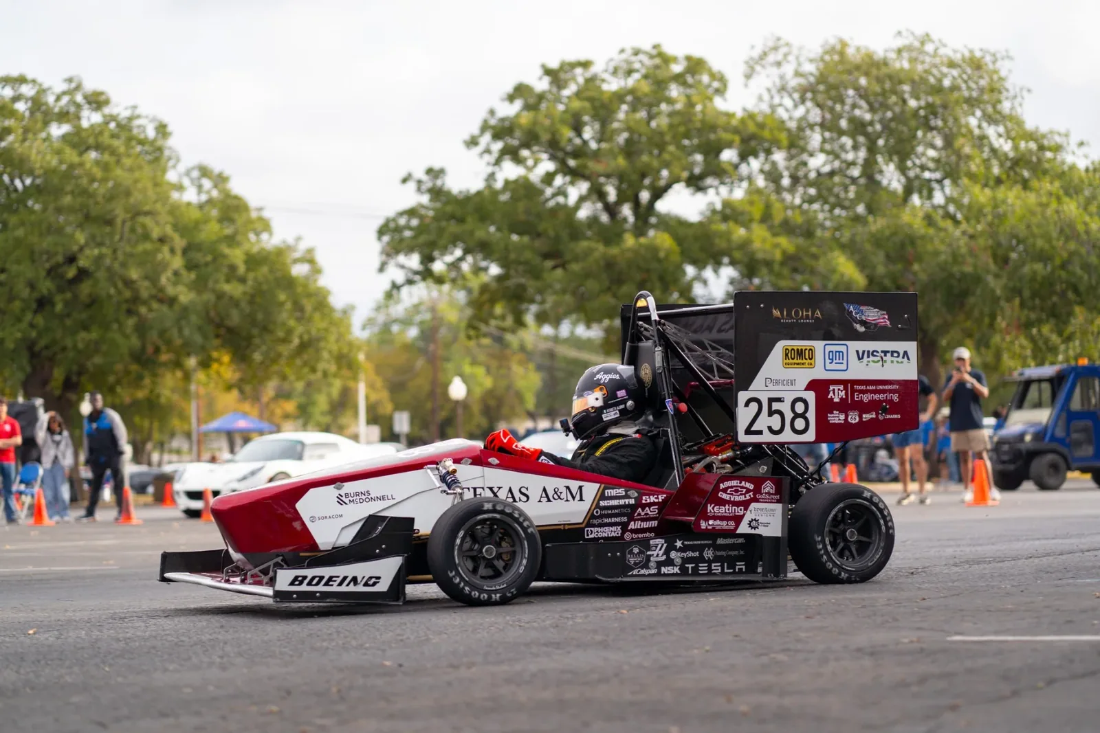 Car 258 on the autocross course with trees behind